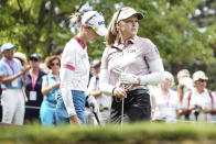 CORRECTS NATIONALITY - Brooke Henderson, of Canada, follows her ball after playing on the 2nd hole during the Evian Championship women's golf tournament in Evian, eastern France, Saturday, July 23, 2022. (AP Photo/Laurent Cipriani)