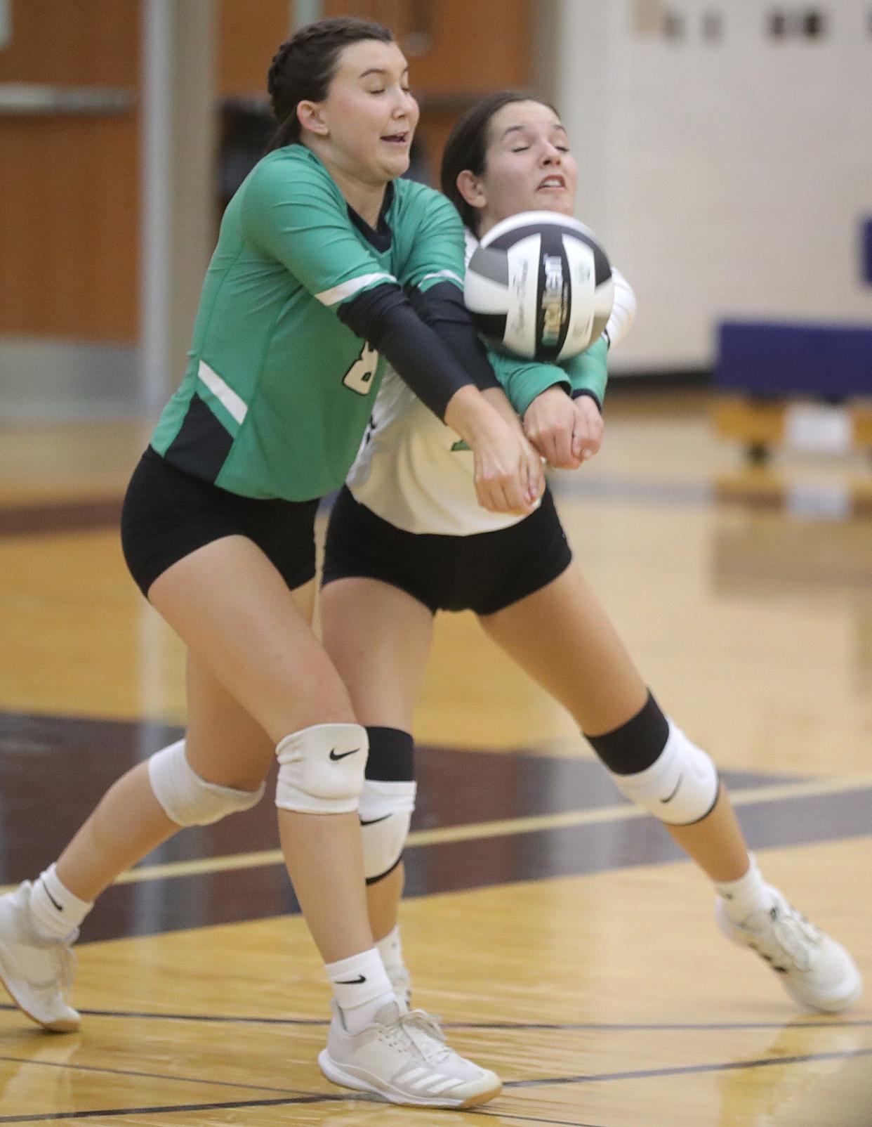 Highland's Sydney Smith, left, and Corinne Mutch return a serve by Tallmadge on Tuesday, Aug. 30, 2022 in Tallmadge.