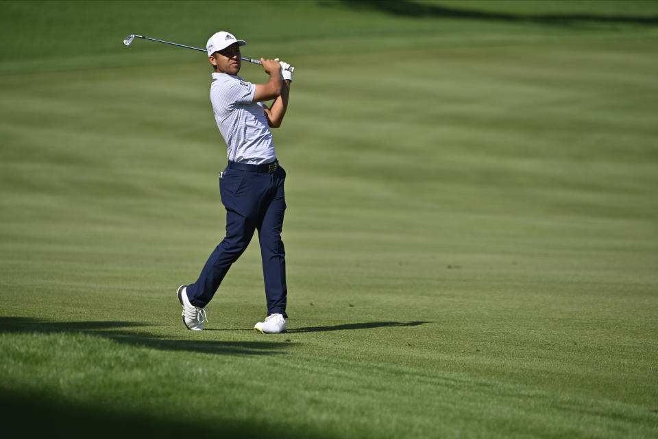 Xander Schauffele makes his second shot on the fourth hole during the final round of the CJ Cup golf tournament at Shadow Creek Golf Course, Sunday, Oct. 18, 2020, in North Las Vegas. (AP Photo/David Becker)