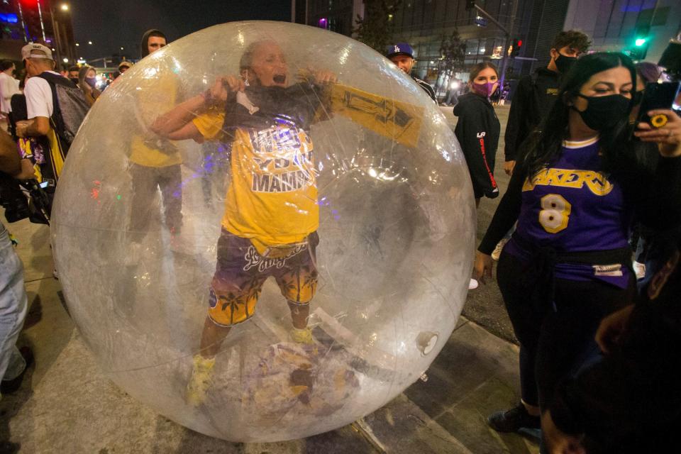 Los Angeles Lakers fans celebrate their team winning the 2020 NBA Championship against the Miami Heat, during the outbreak of Coronavirus disease (COVID-19) in Los Angeles, California, U.S., October 11, 2020. REUTERS/Ringo Chiu TPX IMAGES OF THE DAY