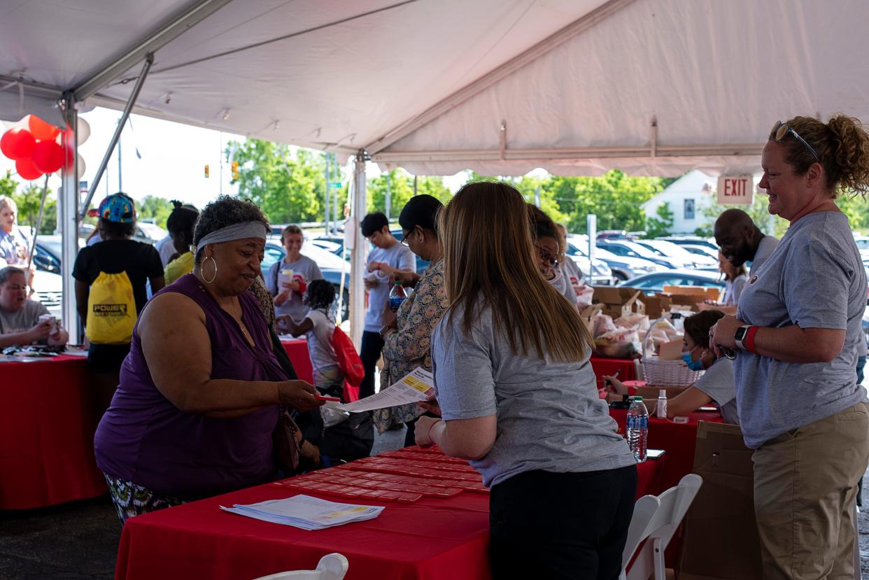 Brigette Wellington, of Columbus, gathers health care information Saturday during Ohio State University Wexner Medical Center’s Healthy Community Day at Ohio State Outpatient Care East.