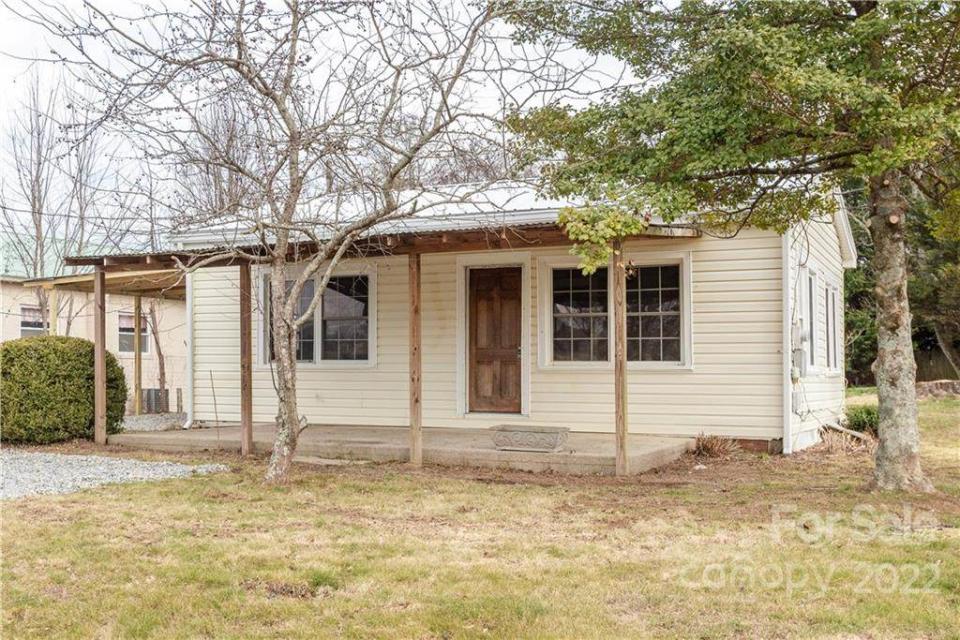 This house at 5751 Howard Gap Road in Flat Rock is listed at $104,900 by BluAxis Realty.