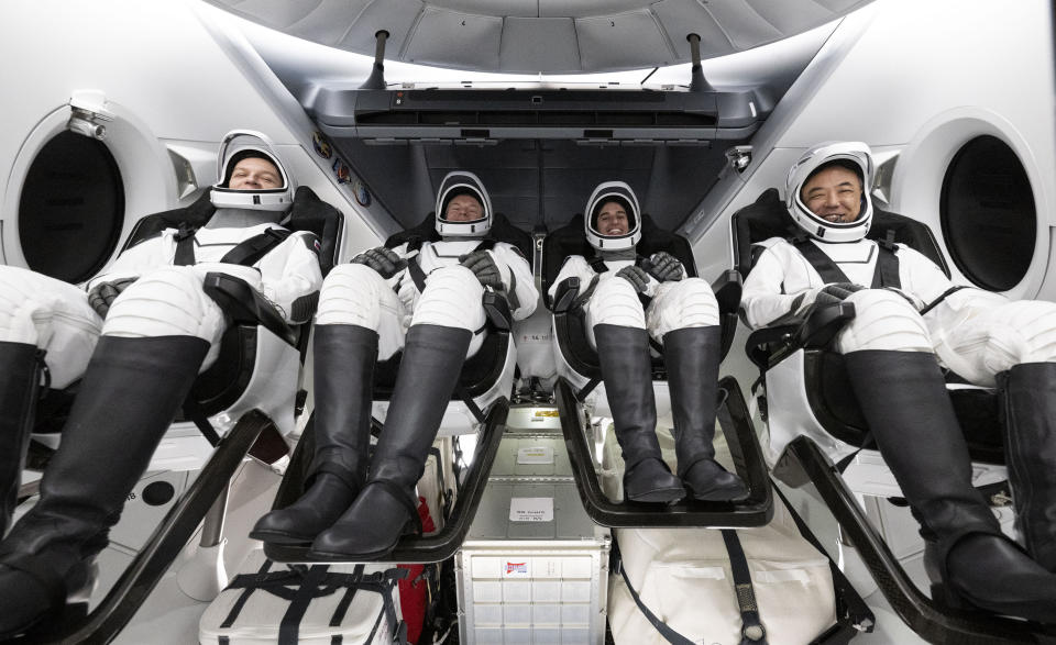 In this photo provided by NASA, Roscosmos cosmonaut Konstantin Borisov, from left, ESA (European Space Agency) astronaut Andreas Mogensen, NASA astronaut Jasmin Moghbeli and Japan Aerospace Exploration Agency (JAXA) astronaut Satoshi Furukawa are seen inside the SpaceX Dragon Endeavour spacecraft onboard the SpaceX recovery ship MEGAN shortly after having landed in the Gulf of Mexico off the coast of Pensacola, Florida, Tuesday, March 12, 2024. The four astronauts caught a lift back to Earth with SpaceX on Tuesday to end a half-year mission at the International Space Station. (Joel Kowsky/NASA via AP)