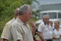 <p>Cuban President Miguel Diaz-Canel arrives at the site of the accident after a Cubana de Aviacion aircraft crashed after taking off from Havana’s Jose Marti airport on May 18, 2018. – A Cuban state airways passenger plane with 113 people on board crashed on shortly after taking off from Havana’s airport, state media reported. The Boeing 737 operated by Cubana de Aviacion crashed “near the international airport,” state agency Prensa Latina reported. Airport sources said the jetliner was heading from the capital to the eastern city of Holguin. (Photo: Yamil Lage/AFP/Getty Images) </p>