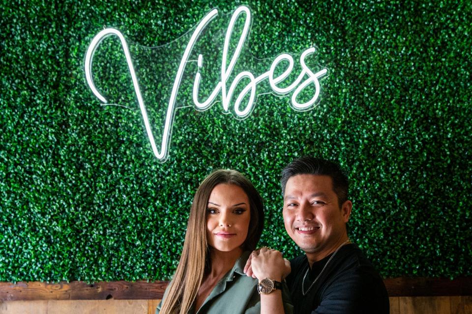 Vibes Kitchen & Bar part owner Elma Gafford and floor manager Tony Truong pose for a photo at the restaurant.