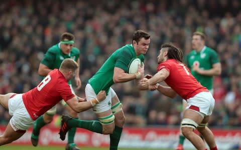  James Ryan (Ireland) drives in to contact with Ross Moriarty (Wales) and Josh Navidi (Wales) - Credit: Getty Images