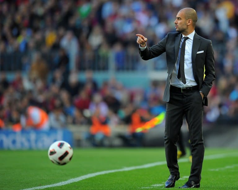 A photo taken on April 23, 2011 shows then-Barcelona coach Pep Guardiola during a league match at the Camp Nou. German giants Bayern Munich won the battle to secure the most sought after coach in football when Guardiola agreed to take over as head coach for the 2013/14 season