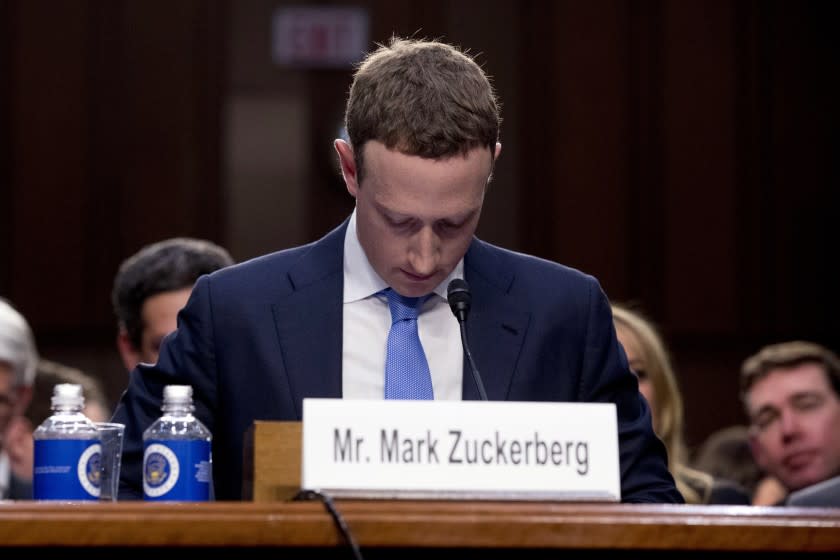 FILE - In this April 10, 2018, file photo Facebook CEO Mark Zuckerberg looks down as a break is called during his testimony before a joint hearing of the Commerce and Judiciary Committees on Capitol Hill in Washington. Twitter's ban on political advertising is ratcheting up the pressure on Facebook and Zuckerberg to follow suit. Zuckerberg doubled down on Facebook's approach in a call with analysts Wednesday, Oct. 30, 2019, he reiterated Facebook's stance that “political speech is important." (AP Photo/Andrew Harnik, File)