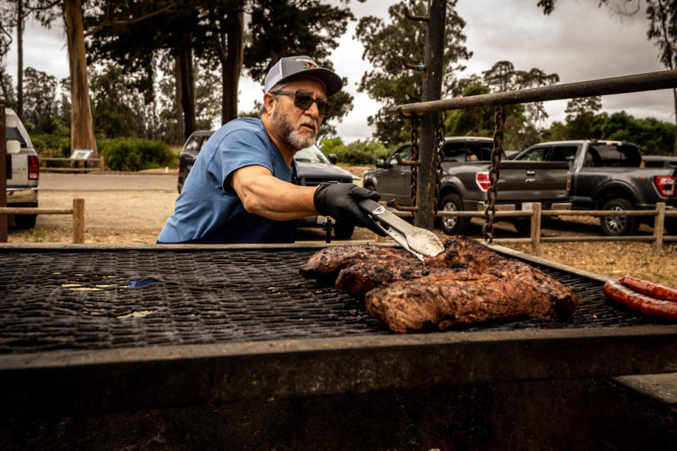 <p>Courtesy of Santa Maria Valley</p><p><strong>Jaime Flores, Organizer of the Santa Maria BBQ Festival</strong></p><p>MK: How does the technique differ using a Santa Maria Grill versus a Traeger or Big Green Egg? </p><p>JF: <em>Santa Maria Style Technique is food cooked over an open pit fire. There is no lid or cover so the meat doesn't bake or steam. Instead a sear happens that locks in all the flavor and juices of the proteins. A grill over the fire has the ability to be raised or lowered to properly cook and for time purposes. A closed smoker sometimes takes up to 15+ hours to cook where a Santa Maria Style BBQ Pit can cook multiple items as fast or as slow as you desire.</em></p><p>MK: What components are most important for you to create the perfect BBQ?</p><p>JF: <em>There are a few things that need to happen for a perfect BBQ. Good quality items and properly aged meats will make a huge impact on the quality and taste of your BBQ. Properly season everything, I like to use some olive oil to coat the meat then season it so it creates a bark when properly seared. A hot fire and grill is key to properly cooking to the appropriate temperatures, avoid using things like lighter fluid or paper to start your fire as it could leave a residual flavor on your food. Grab a cold beverage or a nice glass of chilled wine and enjoy being around the pit with friends and family.</em></p><p>MK: What is the typical wood you use, and what is the origin?</p><p>JF: <em>Santa Maria Style is cooked with locally harvested Red Oak. The Central Coast is known for its beautiful red oaks and for over several decades has been the key to Santa Maria Style BBQ. Our coastline has a few different species of oaks but the Coastal Red is our most abundant. The wood is harvested from trees that have usually fallen or require abatement to avoid falling or burning in its natural environment.</em></p><p>MK: How do you feel wine and bbq compliment each other?</p><p>JF: <em>Wine and BBQ were made for each other. With the various amazing local wines and most of those wines being made in Oak Barrels, the two will always pair well. I enjoy a nice chilled Chardonnay or a Viognier while starting my fire and it pairs well with seafood, vegetables and even proteins like lamb and pork. Our local Pinots and Cabs go well with red meats and poultry plus so many more pairing options can happen by exploring what's available. Honestly there isn't a wine and BBQ pairing that would not work well for all BBQ and wine enthusiasts. </em></p><p><strong>Anthony Avila, Winemaker at Bien Nacido</strong></p><p>MK: What excites you most about making wine from Bien Nacido Vineyard, "the most vineyard-designated vineyard in the world”?</p><p>AA: <em>The thing that excites me the most about making wine from Bien Nacido is the diversity of the vineyard itself. We have at least four distinct soil types spread across all sorts of different elevations, inclinations and exposures to the sun and wind, which actually makes Bien Nacido more like four or five different vineyards all wrapped into one. A Pinot Noir made from grapes grown on one of the hillsides with lots of shale is going to be very different from a Pinot grown closer to the valley floor in sandy loam but they are both still very much “Bien Nacido”. I think the quality of the fruit combined with that broad range of terroir is what has drawn so many wineries, and Winemakers, over the years to make vineyard designated wines from Bien Nacido</em>. </p><p>MK: How does Santa Maria Valley's proximity to the ocean allow for special conditions where you can grow world class Chardonnay & Pinot Noir, but also Syrah at the same time?</p><p>AA: <em>The Santa Maria Valley is a transverse valley which means that it runs from East to West and that makes it distinct from most of the valleys in the world. We are open directly to the Pacific Ocean on the West end and directly to the interior valleys of California on the East end, so the grape growing conditions here change dramatically over very short distances. The further you are from the Ocean the warmer and less windy the Valley is. In addition to that, a small portion of the Bien Nacido vineyard is tucked away in a smaller canyon that branches off to the North of the main Santa Maria Valley where it is relatively more protected from the prevailing sea breeze. That slightly warmer pocket of the ranch is where the majority of our Syrah is planted while grapes like Pinot Noir and Chardonnay tend to be found in colder areas of the vineyard.</em></p><p>MK: BBQ culture is inescapable in your area where Tri-Tip originates, how do your wines enhance the fat, smoke, and salt components of a perfectly cooked tri-tip?</p><p>AA: <em>Our wines are full of fruit character, acidity and structure and those components pair extremely well with Santa Maria style Tri-Tip and BBQ in general. The fruitiness of our wines balances out the smokey, salty flavors, which elevates both the fruit in the wine and the flavor of the BBQ. The natural acidity in wines from Bien Nacido helps to cut through the fat of a rich cut like Tri-Tip and the tannin structure helps to keep the wines from being overpowered by strong flavors. </em></p>