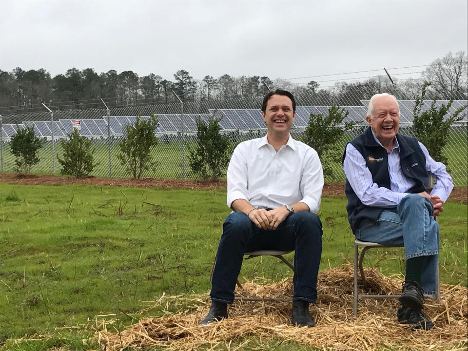 Jason Carter with his grandfather, former U.S. President Jimmy Carter, in Plains, Georgia, at the ribbon-cutting ceremony for a solar farm.