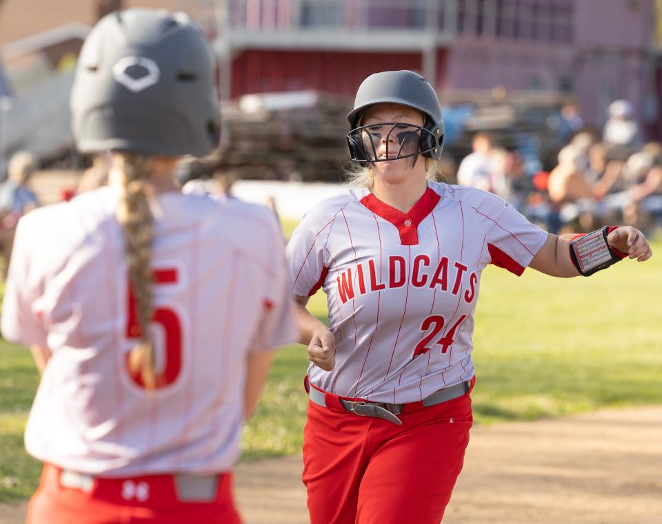 Canton South's Evelyn Lynn heads for home plate after hitting a home run in the third inning of Tuesday's tournament game against Mentor Lake Catholic.