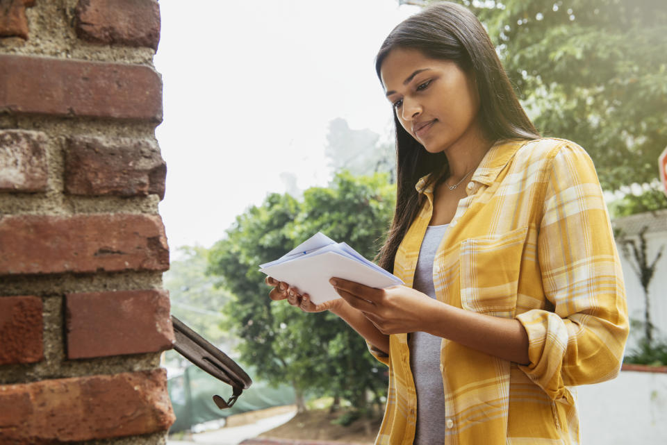 woman checking her mailbox