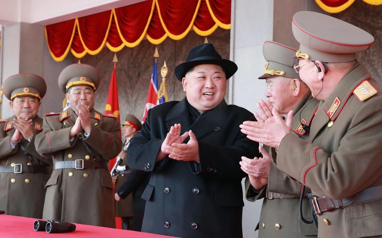 North Korean leader Kim Jong-Un attending a military parade  - AFP