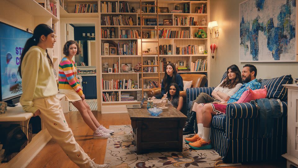 Sunny Sandler as Stacy Friedman, Samantha Lorraine as Lydia Rodriguez Katz, Sadie Sandler as Ronnie Friedman, Zaara Kuttemperoor as Zaara, Idina Menzel as Bree Friedman and Adam Sandler as Danny Friedman in "You Are So Not Invited To My Bat Mitzvah." - Netflix