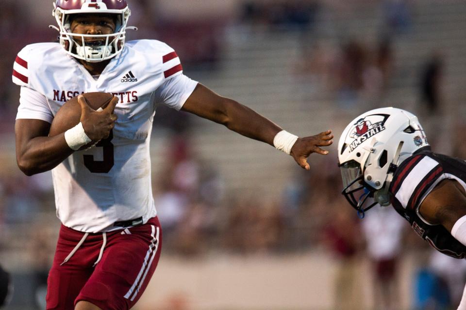 UMass quarterback Taisun Phommachanh runs the ball against New Mexico State on Aug. 25, 2023, at Aggie Memorial Stadium in Las Cruces, New Mexico.