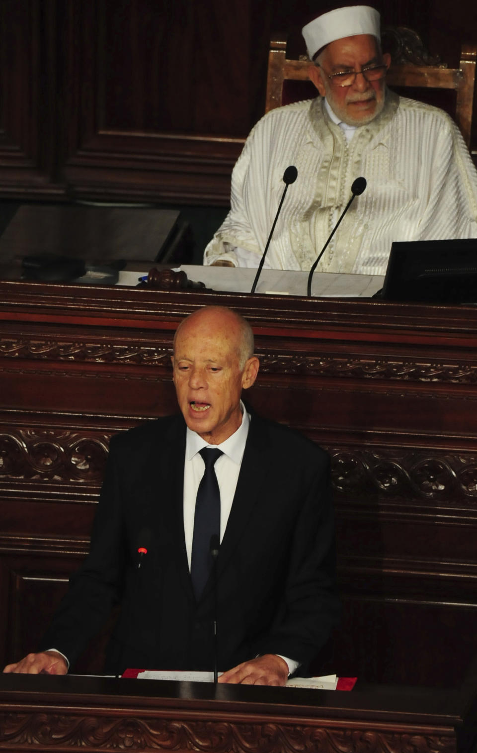 Newly elected Tunisian President Kais Saied speaks during his swearing in ceremony, in Tunis, Wednesday Oct.23, 2019. Tunisians elected former law professor Kais Saied as president earlier this month to replace President Beji Caid Essebsi, who died in July. (AP Photo/Hassene Dridi)