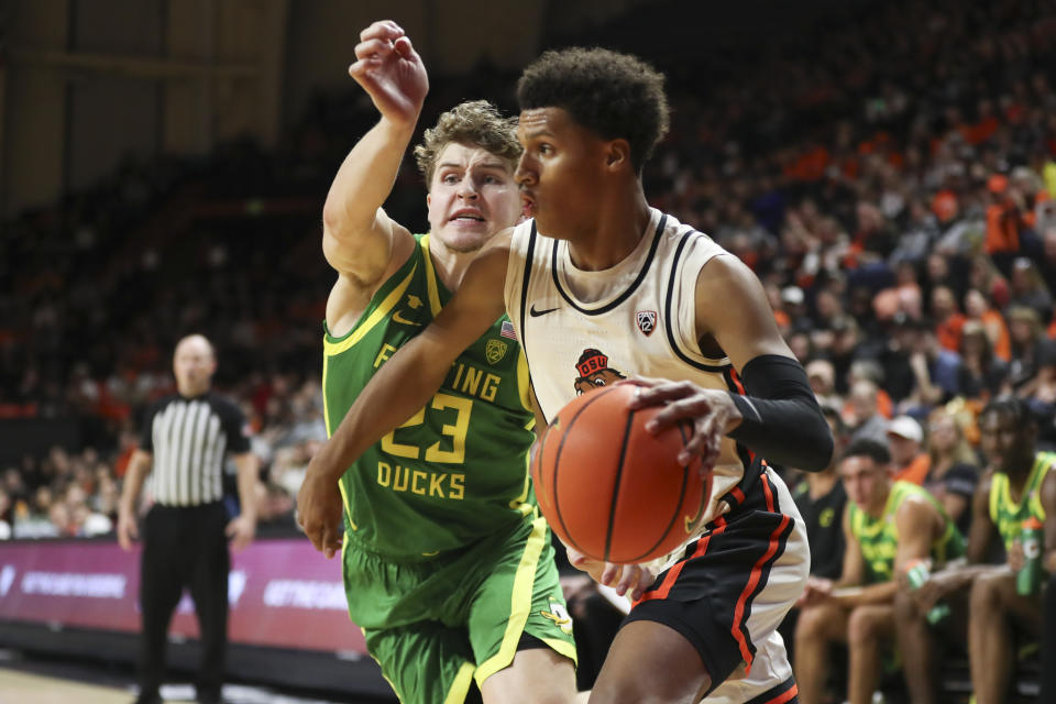 Oregon State guard Josiah Lake II drives to the basket as Oregon guard Gabe Reichle (23) defends during the first half of an NCAA college basketball game Saturday, Feb. 17, 2024, in Corvallis, Ore. (AP Photo/Amanda Loman)