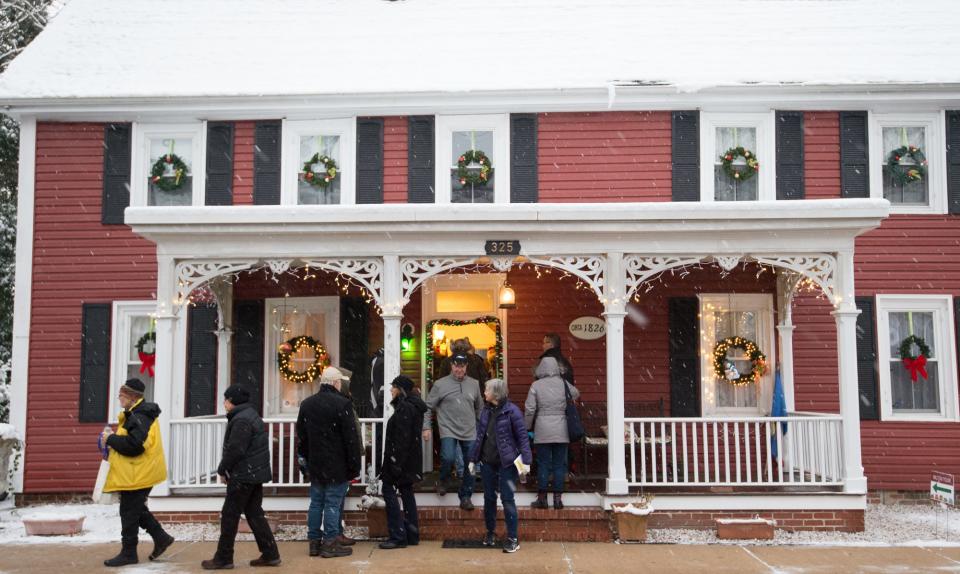 Visitors tour the home of Catherine and Walter Gurczenski during the Holiday House Tour in Milton hosted by the Women's Club of Milton.