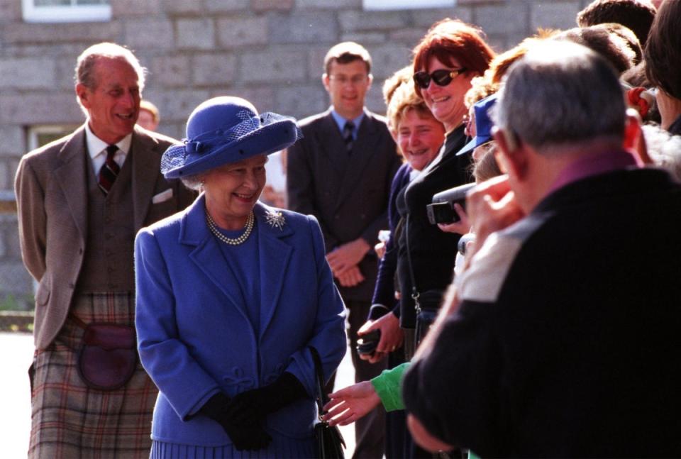 The Queen and the Duke of Edinburgh after unveiling a plaque on the Royal Bridge, Ballater (PA)