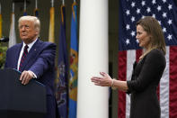 Judge Amy Coney Barrett applauds as President Donald Trump announces Barrett as his nominee to the Supreme Court, in the Rose Garden at the White House, Saturday, Sept. 26, 2020, in Washington. (AP Photo/Alex Brandon)