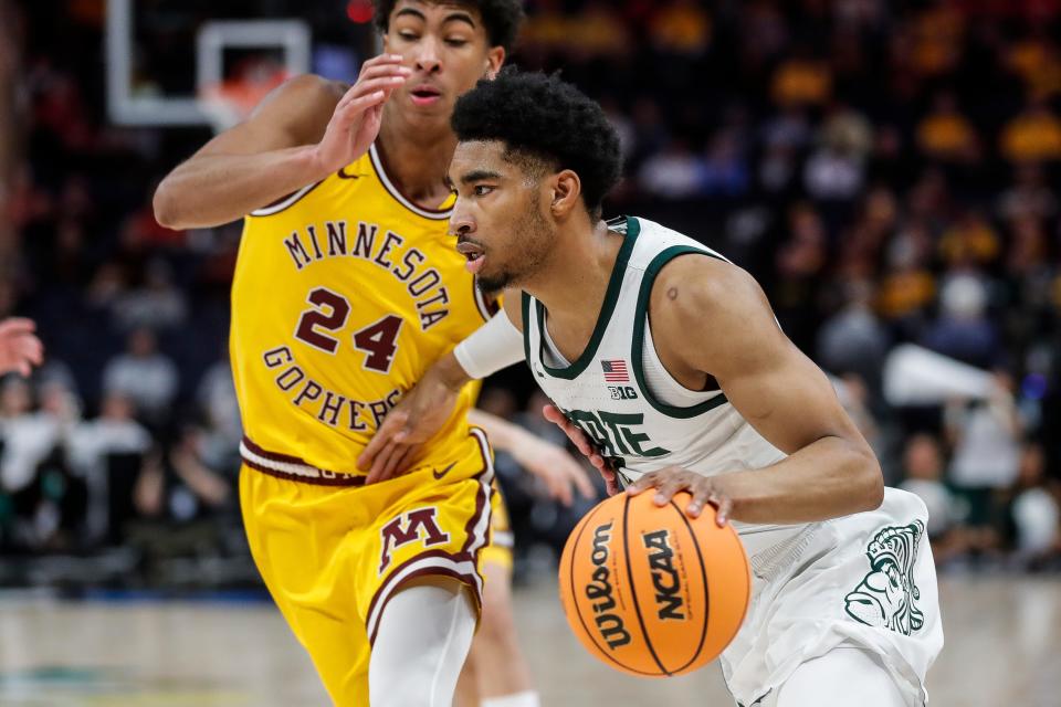 Michigan State guard Jaden Akins (3) dribbles against Minnesota guard Cam Christie (24) during the first half of Second Round of Big Ten tournament at Target Center in Minneapolis, Minn. on Thursday, March 14, 2024.