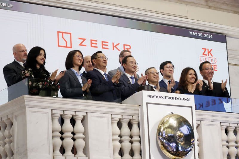 Representatives of the Chinese EV Maker Zeekr ring the opening bell at the New York Stock Exchange on Wall Street in New York City on Friday. The company plans to expand into Europe and Latin America later this year and be in eight nations by 2025. Photo by John Angelillo/UPI