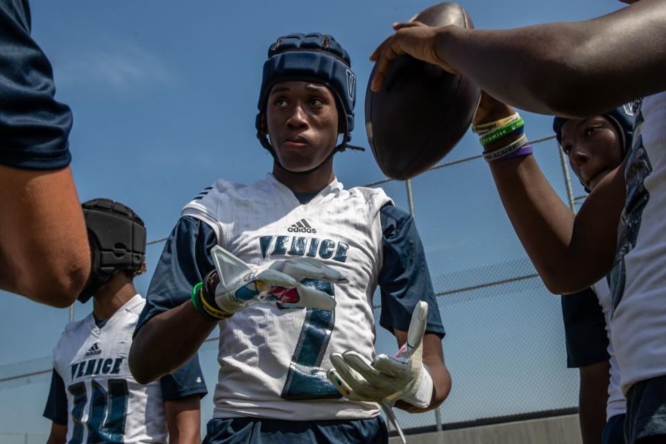 Venice wide receiver Nathan Santa Cruz takes part in a passing competition at Garfield High on Saturday.