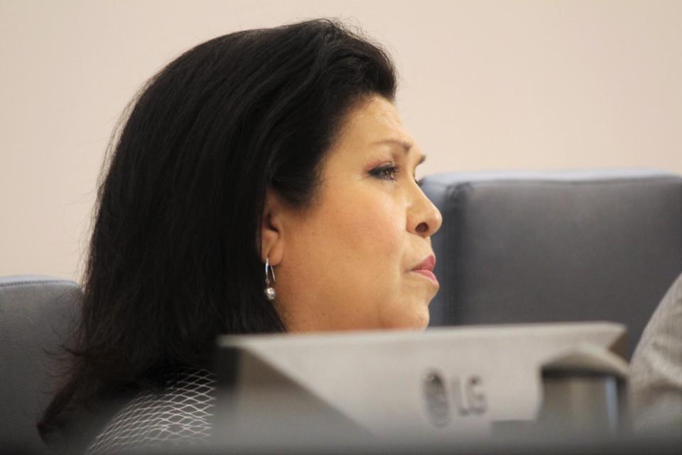 Lubbock City Councilwoman Christy Martinez-Garcia, who represents District 1 including South Overton, listens to arguments in opposition to a proposed zoning change for a student housing development in the neighborhood Tuesday.