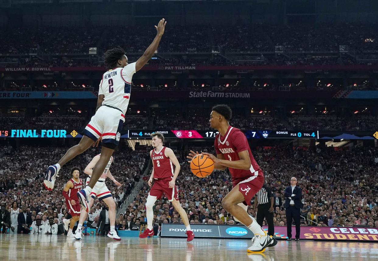 Then with Alabama on April 6, 2024, Rylan Griffen (3) dribbles against Connecticut's Tristen Newton (2) during the Final Four of the NCAA tournament.