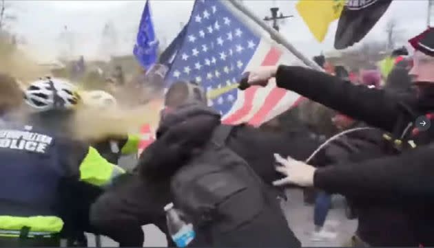 The FBI says this image shows Andrew Taake pepper spraying a D.C. Metropolitan Police officer at the Capitol on Jan. 6. (Photo: FBI)