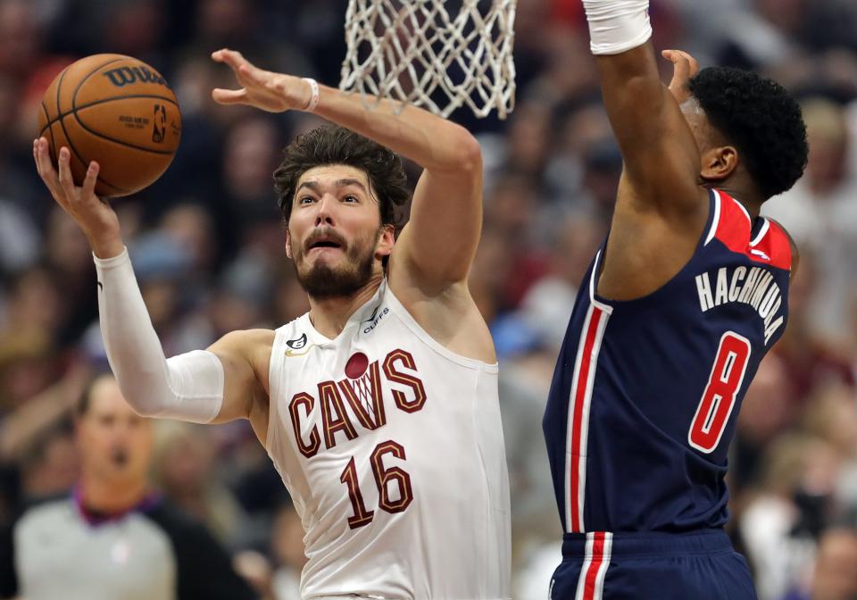 Cleveland Cavaliers forward Cedi Osman (16) looks to the basket for two past Washington Wizards forward Rui Hachimura (8) during the first quarter of an NBA basketball game at Rocket Mortgage FieldHouse, Sunday, Oct. 23, 2022, in Cleveland, Ohio.