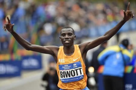 Nov 1, 2015; New York, NY, USA; Stanley Biwott reacts after crossing the finish line to win the Professional Men's division at the 2015 TCS New York City Marathon. Mandatory Credit: Derik Hamilton-USA TODAY Sports -