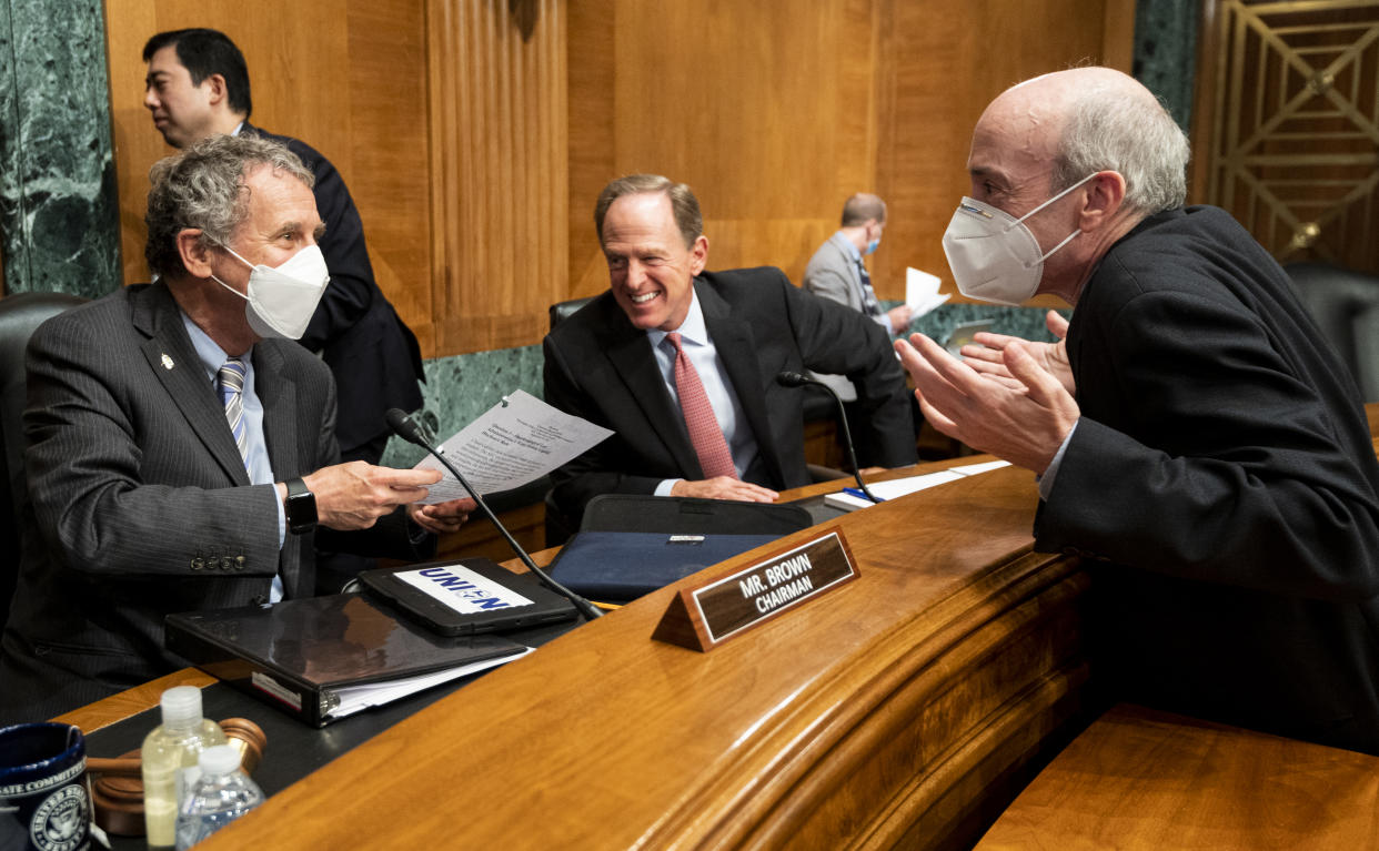 UNITED STATES - SEPTEMBER 14: From left, chairman Sen. Sherrod Brown, D-Ohio, ranking member Sen. Pat Toomey, R-Pa., and witness Gary Gensler,
Chair of the U.S. Securities and Exchange Commission, talk at the end of the Senate Banking, Housing, and Urban Affairs Committee hearing on Oversight of the U.S. Securities and Exchange Commission on Tuesday, Sept. 14, 2021. (Photo by Bill Clark/CQ-Roll Call, Inc via Getty Images)