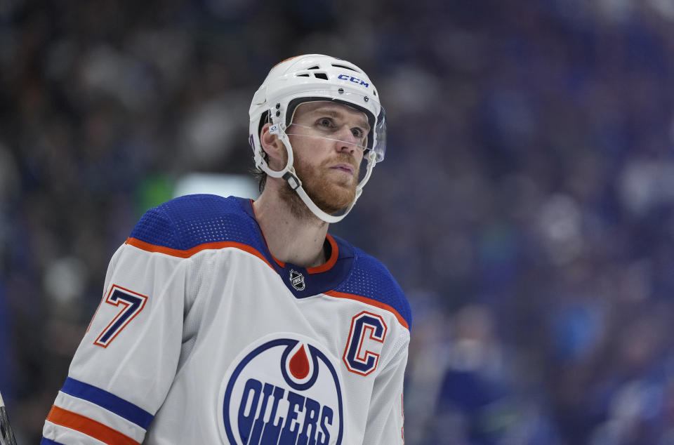 Edmonton Oilers' Connor McDavid waits to take a faceoff against the Vancouver Canucks during the second period of Game 1 of a second-round NHL hockey Stanley Cup playoffs series, Wednesday, May 8, 2024, in Vancouver, British Columbia. (Darryl Dyck/The Canadian Press via AP)