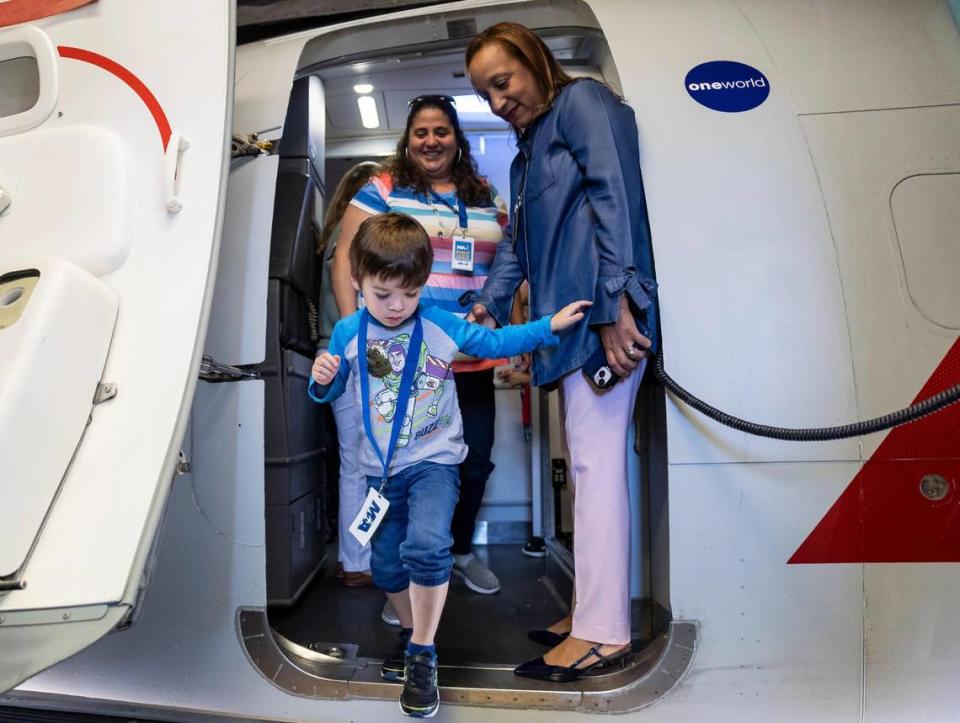 Leonard Frost, 4, deplanes during the MIAair tour at the Miami International Airport on Monday, Oct. 23, 2023, in Miami, Fla. The MIA Airport Instruction and Readiness tour allows about 25 children with special needs to walk through an airport travel experience from start to finish in a safe and controlled environment. MATIAS J. OCNER/mocner@miamiherald.com