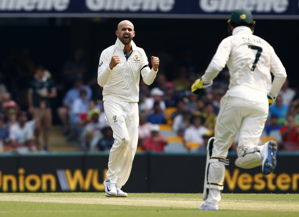 FILE - Australia's Nathan Lyon, left, reacts after getting the wicket of Pakistan's Iftikhar Ahmed, not shown, during a cricket test match in Brisbane, Australia, Thursday, Nov. 21, 2019. Lyon's quest for his 500th test wicket will be one of the individual features of the first cricket test between Australia and Pakistan at Perth Stadium starting Thursday, Dec. 14, 2023. (AP Photo/Tertius Pickard,File)