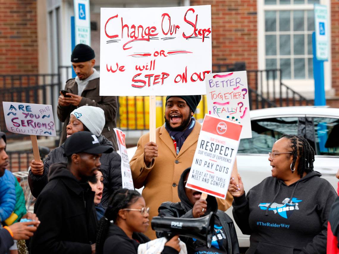 LaRoy Morton, a cafeteria manager at Githens Middle School, center, and others protest outside the Durham Public Schools administrative building in Durham, N.C., Wednesday, Jan. 31, 2024. Twelve Durham public schools were closed Wednesday as staff — furious about unresolved salary issues — called in sick to attend protests.