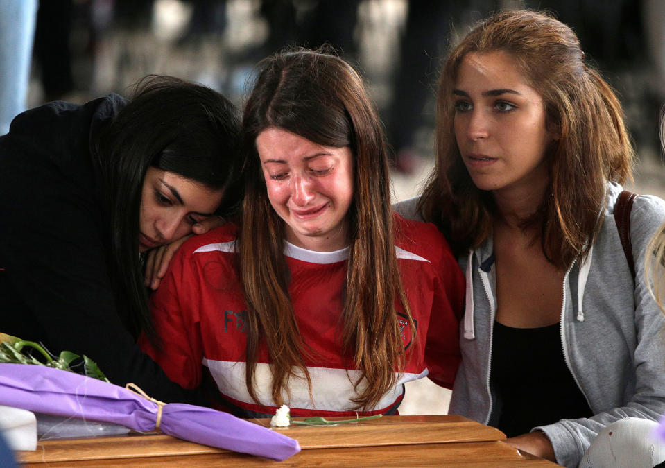 Mourners in Amatrice, Italy