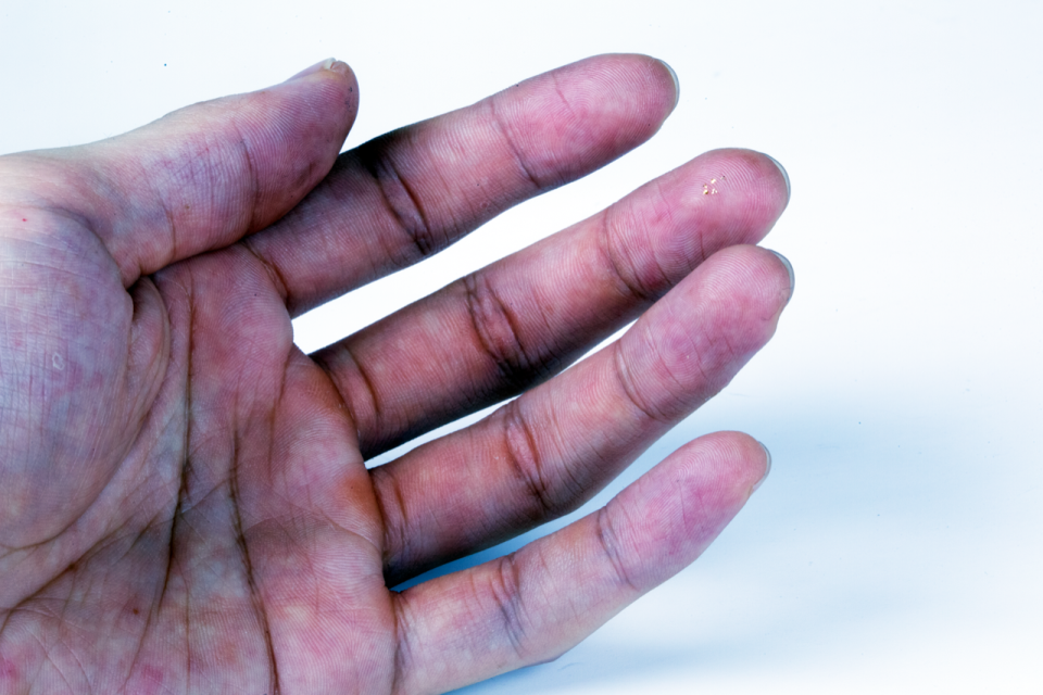 One of Northwestern's tiny 3D microflyers perched on a human hand.