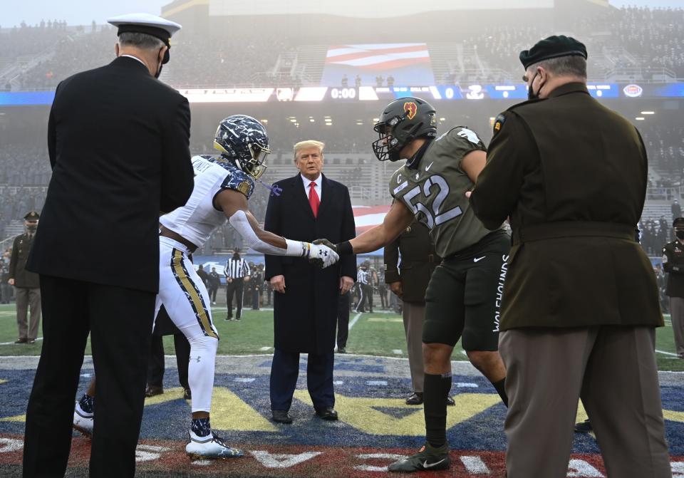 US President Donald Trump looks on after tossing the coin during the Army-Navy football game at Michie Stadium on December 12, 2020 in West Point, New York. (Photo by Brendan SMIALOWSKI / AFP) (Photo by BRENDAN SMIALOWSKI/AFP via Getty Images)