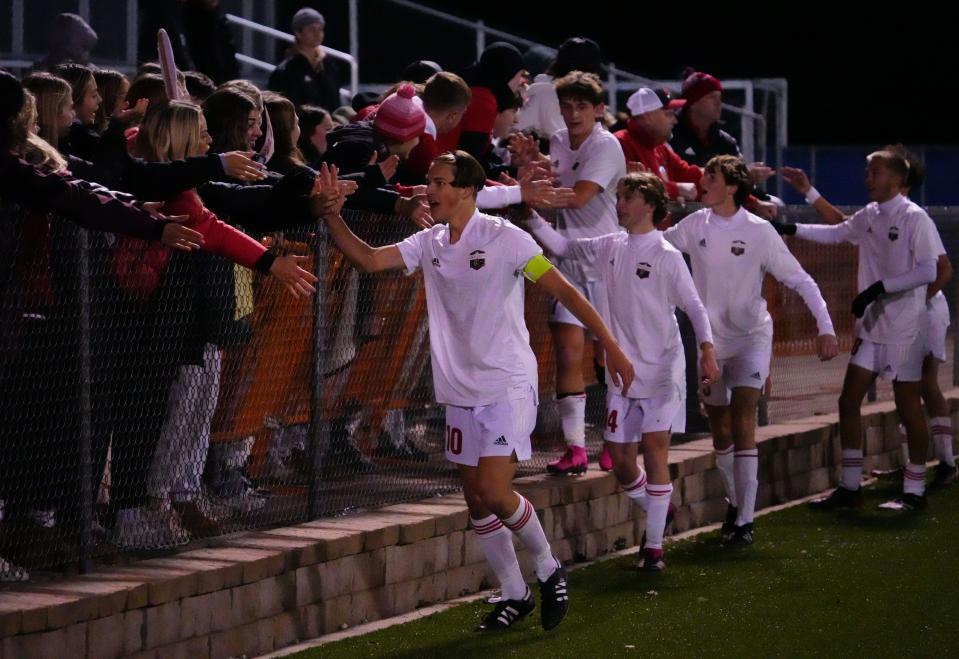 Union Grove players celebrate with fans after a 2-0 victory over DeForest in the WIAA Division 2 boys state soccer semifinal match at Uihlein Soccer Park.