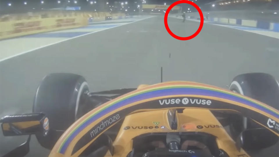 A Formula One marshal who ran on track to put out a flaming car startled McLaren driver Lando Norris as he rounded the corner. Picture: Formula 1