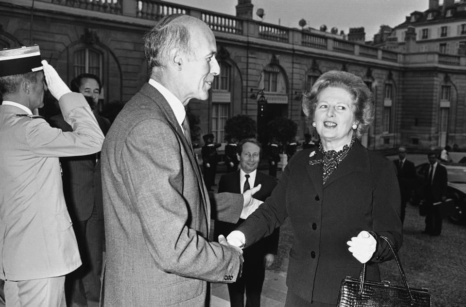 FILE - In this Sept. 19, 1980 file photo French President Valery Giscard d'Estaing greets British Prime Minister Margaret Thatcher at the Elysee Palace in Paris for the 5th France-British summit. Former French President Valery Giscard d'Estaing, 93, who spent much of his life working to forge a united Europe, told The Associated Press in an interview that he regrets Brexit but that Britain's departure isn't a fatal blow for the European Union. (AP Photo/Remy de la Mauviniere, File)