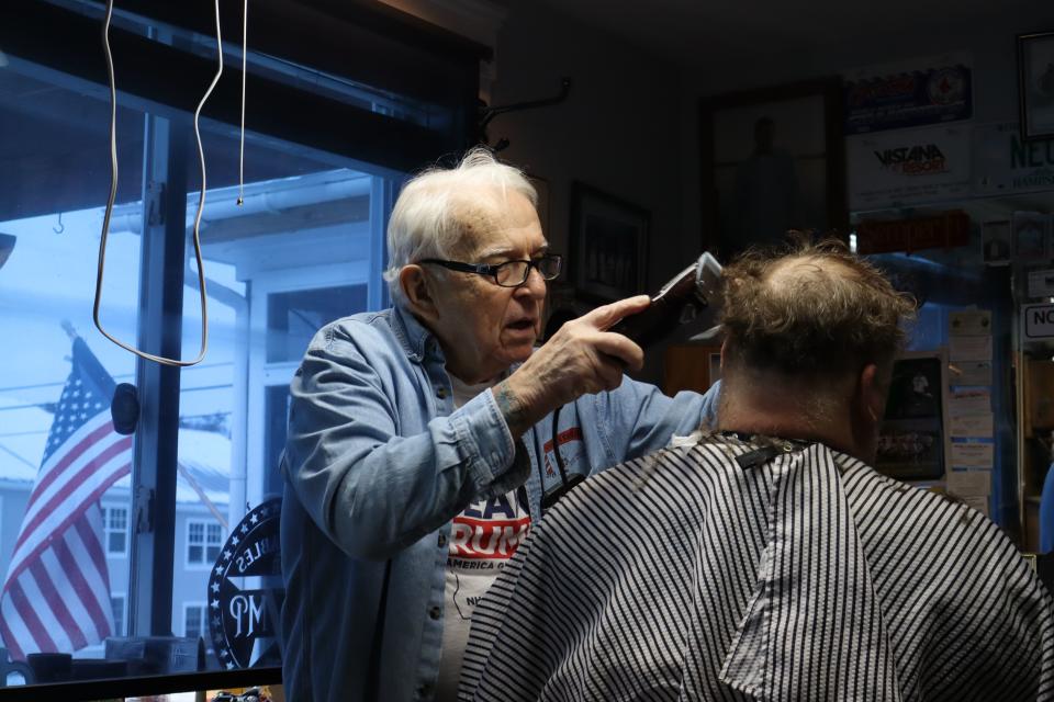 Gary Brockney cuts a client’s hair at Gary’s Barber Shop in Wolfeboro, N.H., on Saturday, Jan. 20, 2024. | Samuel Benson, Deseret News