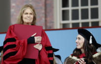 Gloria Steinem clutches her honorary degree as New Zealand Prime Minister Jacinda Ardern looks on at Harvard's 371st Commencement, Thursday, May 26, 2022, in Cambridge, Mass. (AP Photo/Mary Schwalm)