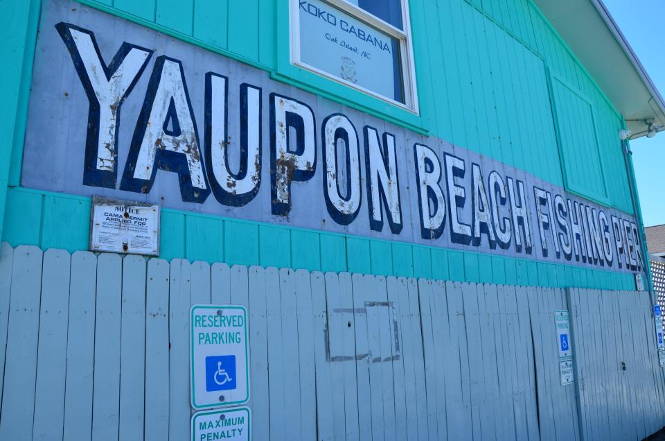 The side of the Pier House for the Oak Island Pier, which still bears the original “Yaupon Fishing Pier” paint work.