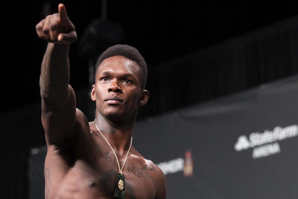 ATLANTA, GA - APRIL 12: UFC middleweight Israel Adesanya of Nigeria gestures to the crowd during the UFC 236 weigh-in at State Farm Arena on April 12, 2019 in Atlanta, Georgia. (Photo by Carmen Mandato/Zuffa LLC via Getty Images)