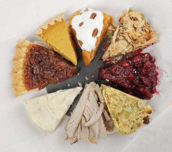 Columbus restaurants and grocery stores are ready to make your Thanksgiving as easy as pie with dishes like: clockwise from top center, sweet potatoes, green bean casserole, cranberry sauce, dressing, turkey, mashed potatoes, pecan pie and pumpkin pie.