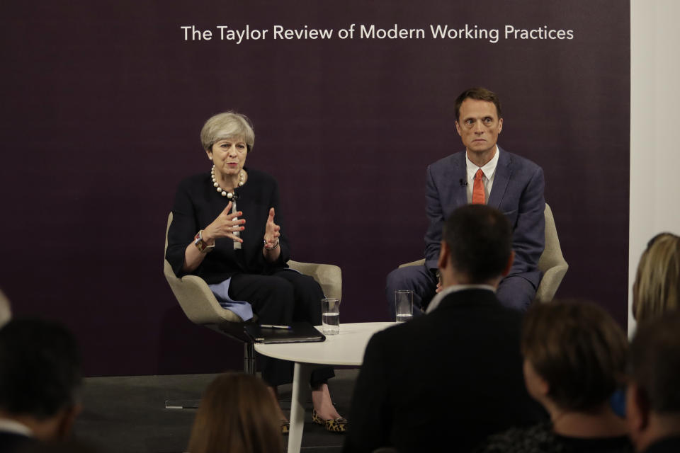 British Prime Minister Theresa May answers a question sat next to RSA Chief Executive Matthew Taylor after delivering a speech at the RSA (Royal Society for the encouragement of Arts, Manufactures and Commerce) in London, Tuesday, July 11, 2017. (AP Photo/Matt Dunham, Pool)