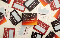 This product image shows the card game It’s a Date! with scratch-off date ideas for couples. Interactive card games are good options for holiday gifts. (It’s a Date! via AP)